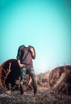 a man standing in front of an old train track with his hand on his face