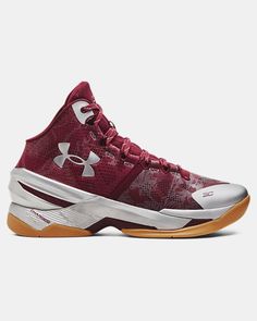 the under armour basketball shoe is red and silver