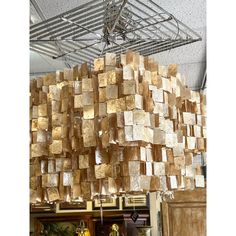 a room filled with lots of wooden blocks on top of a metal frame ceiling mounted to the ceiling