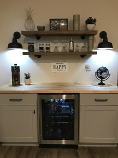 a kitchen with an oven, counter and shelves on the wall that have happy written on it