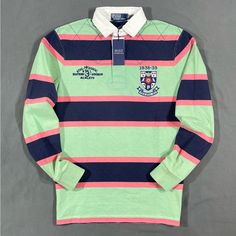 Polo Ralph Lauren Striped Rugby Shirt Details - Brand New With Tags - Sizes : Medium, Large Available. Xl Sold Out - Colors : Green / Navy Blue / Salmon - Collegiate Logo Patch Top Left Chest - “Rl 3 Eastern Division” Embroidered Top Left Chest - 100% Cotton - Fit : Classic - Quarter Top Quilt Stitching Shipping - Item Will Be Shipped The Same Day Of Purchase Or The Very Next Business Day. Tracking Included. Fully Insured Blue Long Sleeve Shirt With Striped Collar, Blue Collared Tops For College, Long Sleeve Blue Shirt For College, Blue Long Sleeve Shirt For College, Green Long Sleeve Shirt With Striped Collar, Striped Long Sleeve Tops For College, Preppy Long Sleeve Tops For College, Multicolor Cotton Top With Striped Collar, Classic Blue College Tops