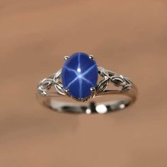 a ring with a blue stone on it