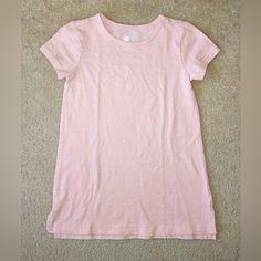 Primary Size 6/7 Short Sleeve Cotton Slub Legging Tee (Tunic Length) In The Color Flamingo, A Peachy Pink. Not Currently Sold On The Website. This Is Crossposted. Very Good Used Condition For Light Wash Wear. Never Worn Here, But We Are Not The First Owner. Fitted Short Sleeve T-shirt For Playwear, Spring Short Sleeve Tops For Playwear, Spring Crew Neck T-shirt For Play, Spring Playwear Crew Neck T-shirt, Basic Pink Summer Shirt, Pink Casual Tops For Sleepover, Summer Crew Neck Tops For Sleepover, Short Sleeve Cotton Tops For Playwear, Pink Cotton T-shirt For Sleepovers