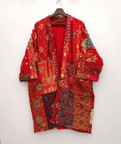 Kantha Kimono Robe, Jacket Coat, 100% Cotton Patchwork Embroidery Jacket Coat, Hand-Stitched, Bohemian Patchwork Kimono, Dressing Gown Message us for Custom / Wholesale / Bulk Order inquiries. This Kimono is made of hand Kantha stitch fabric in patchwork The Fabric is a handmade printed Fabric, opened Embroidery Jacket kantha work. 100% cotton fabric, hand crafted by the vintage kantha Made with the cotton fabric with reversible pattern perfectly quilted for winters. Patchwork Embroidery Cotton Long Sleeve Patchwork Kimono For Festivals, Long Red Patchwork Outerwear, Red Long Patchwork Outerwear, Winter Vintage Kimono With Patchwork, Festive Bohemian Long Sleeve Robe, Vintage Long Sleeve Kimono With Patchwork, Vintage Long Sleeve Patchwork Kimono, Embroidered Winter Outerwear With Kimono Sleeves, Long Sleeve Multicolor Embroidered Kimono For Fall