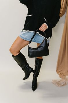 Embrace effortless style with the Noey Black Slouched Tall Boot. Made from sleek black faux leather, this boot is designed with a relaxed, slouched tall shaft for a chic and casual look. The sturdy block heel ensures comfort and stability, while the pointed toe adds a touch of sophistication. Perfect for day-to-night wear, the Noey boot pairs beautifully with any outfit, offering a blend of modern elegance and everyday ease. Clear Purses, Faux Leather Purse, White Bodycon Dress, Travel Dress, Tall Boot, Faux Leather Belts, Night Wear, Jumpsuit Shorts Rompers, Maxi Dresses Casual