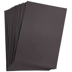 six black cards with white writing on the front and one is dark gray in color