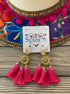 These Beautiful Mexican Earrings are made with the Mexican art form of twisting gold plated wires to create beautifully intricate works of art. The silk thread tassel adds that beautiful pop of color to any outfit. These earrings are handmade by Mexican Artisans. Gold Tassel Earrings For Festivals, Gold Fringe Tassel Earrings For Festival, Gold Elegant Tassel Earrings For Festival, Elegant Gold Tassel Earrings For Festival, Mexican Earrings, Floral Filigree, Embroidered Belt, Beautiful Belts, Traditional Mexican