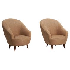 a pair of mid century modern chairs