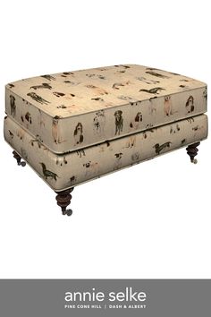 an upholstered footstool with horses on it and the words annie selke