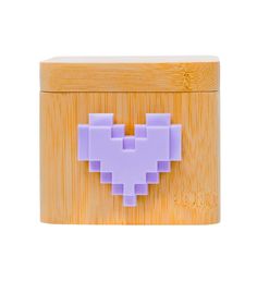 a wooden box with a purple pixel heart on it