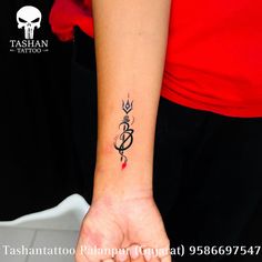 a woman's arm with a tattoo on it and an arrow in the middle