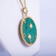 Elevate your elegance with this exquisite Van Cleef & Arpels necklace, a timeless piece from the 1950s-60s. Featuring a large, vibrant malachite pendant adorned with the Gemini zodiac sign, this necklace beautifully merges astrological significance with high-end craftsmanship. The pendant hangs gracefully from a luxurious 18K gold chain, both signed and marked with the iconic VCA signature, ensuring authenticity and quality. Embrace a piece of history and sophistication with this remarkable Van Cleef & Arpels creation. Luxury Green Cabochon Necklace, Luxury Oval Pendant Necklace For Collectors, Green Medallion Necklace For Formal Occasions, Vintage Malachite Jewelry For Gifts, Vintage Malachite Jewelry Gift, Luxury Green Medallion Necklace, Elegant Oval Malachite Necklace, Van Cleef Arpels Necklace, Jewelry Van Cleef