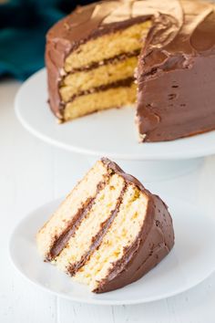 two pieces of cake on plates with one slice missing