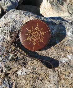 The Snowflake Leather Round Purse is a handmade leather purse which I made by myself. It's a great and cute leather accessory or gift for birthday. It measures approximately 12,5 cm or 4,92 inches diameter. The Snowflake purse will be lovingly wrapped and shipped to you within 1-3 days of payment. Handmade Brown Clutch Coin Purse, Handmade Leather Coin Purse For Personal Use, Handmade Leather Coin Clutch, Handmade Leather Coin Purse Clutch, Handmade Brown Leather Clutch, Hand Tooled Leather Coin Purse For Gift, Handmade Leather Clutch Coin Purse, Brown Clutch Coin Purse As Gift, Handmade Brown Coin Purse Pouch