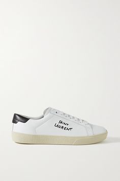 SAINT LAURENT's low-top 'Court Classic' sneakers are embroidered with the label's logo in black stitching at the side. They've been made in Italy from smooth white leather and have contrasting heel tabs and durable rubber soles. Wear yours with distressed denim or feminine dresses. Saint Laurent Court Classic, Designer Sneakers Women, Saint Laurent Sneakers, Saint Laurent Tote, Saint Laurent Jeans, Feminine Dresses, Ysl Shoes, Embroidered Leather, Luxury Sneakers