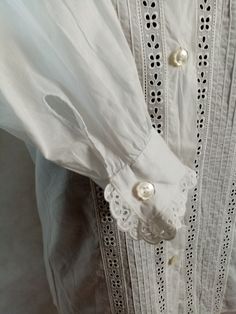 Vintage romantic blouse, button up, lace trim, long sleeve, 100% cotton. In very good clean condition. Flat measurements: shoulders - 37 cm/ 14.5'' chest/pit to pit/ - 49 cm/ 19.2'' sveeve/from shoulder/ - 64 cm/ 25.2'' lenght - 65 cm/ 25.5'' The measurements correspond to the size M Classic Blouse With Lace Cuffs For Daywear, Vintage White Cotton Blouse For Spring, Cotton Broderie Anglaise Blouse For Daywear, Collared Blouse With Lace Cuffs For Daywear, Elegant Cotton Eyelet Tops, Blouse With Lace Cuffs And Collar For Daywear, Cotton Blouse With Broderie Anglaise For Daywear, Long Sleeve Blouse With Lace Work For Daywear, Classic Wedding Blouse With Buttons