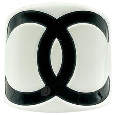 A stunning oversize Chanel Monochrome CC Cuff from the 2000s. Crafted in resin. Featuring a gigantic bold black interlocking CC logo on a white background to create a seriously iconic monochrome cuff. In very good condition, signed, approx. 6cm deep, internal diameter approx. 6cm, opening/gap approx. 2.8cm. A total looker that will forever seal your style with the magic of the House of Chanel. Established in 2016, this is a British brand that is already making a name for itself in the jewellery Chanel Cuff, Chanel Jumbo, Cute Birthday Outfits, The 2000s, Fashion Wishlist, Vintage Jewels, Cc Logo, Timeless Treasures, Bold Black