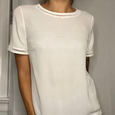 Slightly Sheer Short Sleeve Ivory Top With Sweet Cutouts Around Hem. Size Xs. Elegant Off White Short Sleeve Top, Elegant Crew Neck Blouse For Brunch, Elegant Crew Neck Top For Day Out, Elegant Crew Neck Top For Brunch, White Crew Neck Blouse For Brunch, Chic Off White Short Sleeve Blouse, Chic Off-white Short Sleeve Blouse, Classic White Tops For Brunch, Chic Cream Short Sleeve Blouse