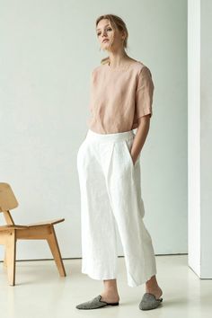 Optical white heavy linen pants for women.  The wide-leg linen trousers slight pleats at the front. The pants are ankle high and have a slightly lowered waist.   #whitelinenpantswithpockets #wideanklelinenpants #whiteculottes #stlishlook #streetlook #linenoutfit #whitelinentrousers #whitelinenpants #whitewidepants #whitetrousers Relaxed Fit Linen Culottes With Wide Legs, Linen Straight Culottes For Summer, Relaxed Fit Linen Wide Leg Culottes, Summer Linen Straight Culottes, Spring Linen Culottes With Pockets, Spring Straight Linen Culottes, Spring Linen Straight Culottes, Straight Linen Culottes With Pockets, Wide Leg Linen Culottes For Work