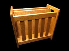 a close up of a wooden crib on a black background