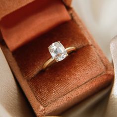 an engagement ring in a velvet box