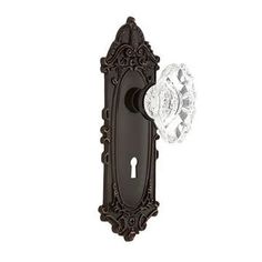 an antique style door handle with crystal knob