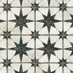 a white and brown tile with stars on it