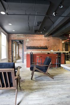 an empty room with chairs and tables in it