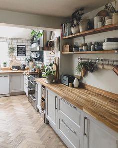 a kitchen filled with lots of wooden counter tops