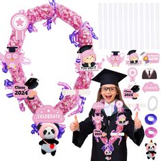 a girl in graduation cap and gown holding up some decorations