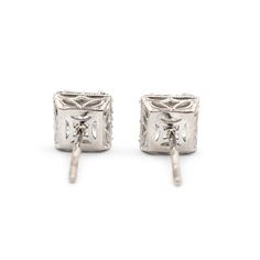 Brand: Tacori  Gender: Ladies  Metal Type: 18K White Gold  Length: 0.50 Inches  Width: 6.50 mm  Weight: 2.10 grams  Ladies filigree-style 18K white gold diamond halo stud earrings with push backs. Engraved with "18K". The "Tacori" trademark (or hallmark) can also be found on the item.  Pre-owned in excellent condition. Might shows minor signs of wear.  V-Prong Set in 18 Karat White Gold with:  Two (2) princess cut natural diamonds:  Measurements: 4.88mm x 5.00mm x ~3.50mm in depth. Weight Range: Luxury Hallmarked Diamond Earrings For Formal Occasions, Luxury Platinum Diamond Earrings Hallmarked, White Platinum Hallmarked Earrings, Classic Hallmarked Diamond Earrings, Classic Diamond Cut Bridal Earrings For Evening, Formal Diamond Earrings With Diamond Accents, Classic Bridal Earrings With Prong Setting For Evening, Classic Bridal Earrings For Evening With Prong Setting, Traditional Diamond Earrings For Formal Occasions