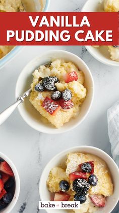 vanilla pudding cake with berries and powdered sugar in two white bowls on a marble countertop