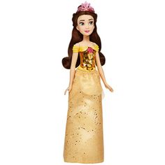 the doll is wearing a gold dress with a pink flower on it's head