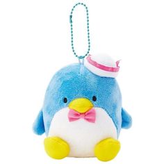 a blue penguin with a pink bow and hat on it's head is hanging from a chain