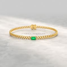 Elevate your style with this stunning Natural Emerald Cuban Chain Link Statement Bracelet in 14K Yellow Gold. Perfect for graduation gifts or personalized jewelry, this Cuban curb chain bracelet features a vibrant emerald centerpiece. Luxurious and eye-catching, this 14K yellow gold chain bracelet is sure to make a statement. 𝐅𝐞𝐚𝐭𝐮𝐫𝐞𝐬: * 𝐌𝐚𝐝𝐞 𝐭𝐨 𝐎𝐫𝐝𝐞𝐫 * 𝐌𝐞𝐭𝐚𝐥: 𝟏𝟎𝐊 𝐆𝐨𝐥𝐝 | 𝟏𝟒𝐊 𝐆𝐨𝐥𝐝 | 𝟏𝟖𝐊 𝐆𝐨𝐥𝐝 | 𝟗𝟓𝟎 𝐏𝐥𝐚𝐭𝐢𝐧𝐮𝐦 * 𝐁𝐚𝐧𝐝 𝐂𝐨𝐥𝐨𝐫𝐬: Rose Gold, Elegant Cuban Link Bracelet As Gift, Yellow Gold Bracelets For May Birthstone, 14k Gold Bracelet For Formal Occasions With May Birthstone, Yellow Gold Emerald Bracelet For Formal Occasions, Formal 14k Gold Bracelet With May Birthstone, Formal Yellow Gold Bracelets For May Birthstone, Formal Yellow Gold Bracelet With May Birthstone, Fine Jewelry Diamond Bracelet With Solid Link For Gift, Elegant Curb Chain Bracelets For Anniversary