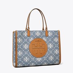 Our iconic tote and signature T Monogram combine in washed denim jacquard. Instantly recognizable, our Ella Tote is a versatile essential — sturdy and light, spacious and streamlined, with an oversized logo. Tory Burch Ella Tote, T Monogram, Ella Tote, Tory Burch Ella, Tory Burch Tote, Monogram Tote Bags, Designer Tote Bags, Oversized Bag, Womens Designer Handbags