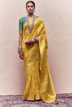 Upgrade your saree collection with our Silk Saree. Made from pure crepe dola silk, it features heavy viewing work and tussles on the pallu. The perfect blend of elegance and luxury, this saree will make you stand out at any event. Elevate your style game with this exquisite piece. Stitching Option - We will email you the measurement guide to confirm your size. FABRIC: Pure Crepe Dola Silk With Heavy Viewing Work And Tussles On Pallu SAREE FABRIC SIZE: 5.5 Meters BLOUSE FABRIC SIZE: 0.80 Meters S Dola Silk Saree, Yellow Saree, Half Sleeve Blouse, Art Silk Sarees, Fancy Blouses, Zari Work, Indian Sari, Traditional Sarees, Yellow Fabric