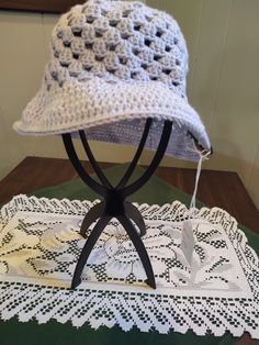 A granny stitch sun hat made from 100% cotton. Machine washable (gentle cycle, cold water); hang or lay flat to dry. Handmade Sun Hat For Spring Outdoor, One Size Cotton Bucket Hat, Cotton One Size Bucket Sun Hat, Cotton Bucket Sun Hat, Warm Weather Cotton Hat, Handmade Spring Outdoor Sun Hat, Spring Cotton Adjustable Crochet Hat, Lightweight Cotton Hats For Warm Weather, Adjustable Cotton Yarn Bucket Hat For Spring