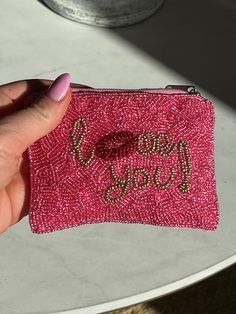 The cutest gift for one of your girlies or to treat yourself! This love you pink beaded wallet is so cute as a coin purse or to throw some cards in. Shop now! Pink Rectangular Wallet For Party, Cute Pink Coin Purse As Gift, Pink Pouch Coin Purse As Gift, Cute Pink Coin Purse For Gift, Pink Coin Purse With Card Slots As Gift, Pink Leather Coin Purse As Gift, Compact Pink Bags For Gifts, Pink Pouch Coin Purse Gift, Pink Coin Purse With Card Slots For Gift