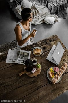 a person sitting at a table with food on it