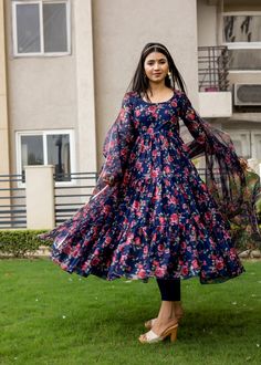 PRODUCT DESCRIPTION :- Be the twirl ready this festive season in our floral printed Anarkali . Crafted with premium chanderi cotton and classy silhouettes.Anarkali :- chanderi cottonPant :- CottonDupatta :- Organza silkClosure Used:- Side zipColor:-Anarkali and dupatta - Navy blue Pant - Navy BlueCare Instructions :- Dry clean onlyModel Size :- Model is wearing XS sizeModel Height :- 5.6''DISCLAIMER :- Slight color variations may occur due to different screen resolution. Floral Long Frocks Indian, Festive Blue Floral Anarkali Set, Blue Floral Print Anarkali Set For Eid, Blue Floral Anarkali Set For Eid, Blue Anarkali Set With Floral Print Straight Kurta, Festive Blue Floral Print Anarkali Set, Unstitched Blue Floral Print Anarkali Set, Floral Print Cotton Churidar, Festival Blue Salwar Kameez With Floral Print