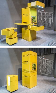 two yellow boxes are stacked on top of each other in front of a gray wall