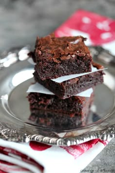 three pieces of chocolate brownie on a plate