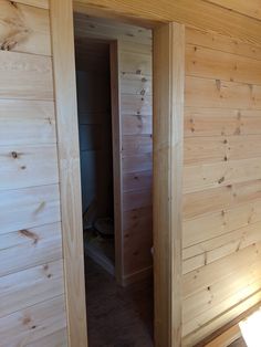 the inside of a cabin with wooden walls