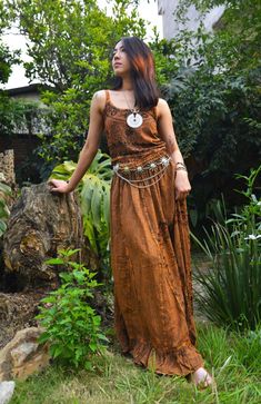 Introducing our Pari Vintage Vibe Brown Top & Maxi Skirt, perfect for embracing boho hippie vibes! This stunning set includes a maxi skirt with a pleated border that adds a touch of elegance and offers a chic, comfortable fit. Crafted with comfort yet elegant fashion in mind, this ensemble is ideal for creating enchanting looks. Choose between two top variations: a halter top or a smocked top, both designed to complement the flowing silhouette of the skirt. Available in various sizes, this set c Bohemian Flowy Tiered Maxi Dress, Festival Flowy Tiered Maxi Dress, Bohemian Tiered Skirt Maxi Dress, Bohemian Tiered Skirt Maxi Dress For Festival, Flowy Long Skirt Dress For Festivals, Bohemian Flowy Floor-length Maxi Skirt, Hippie Flowy Boho Print Maxi Skirt, Hippie Flowy Maxi Dress, Flowy Boho Print Hippie Maxi Skirt