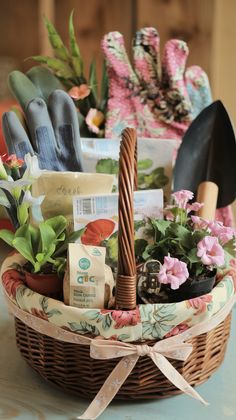 a basket filled with gardening items on top of a table