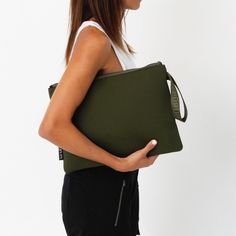 Meet the Oversized Neoprene Pouch—your new go-to accessory for work and play! This sleek pouch easily fits both 13-inch and 14-inch laptops, but it’s not all business, with enough room for your tech and a few essentials (like your phone and favorite lip balm), it's perfect for those busy days that turn into spontaneous evenings, or even for a beach weekend, and city outings! With a wristlet strap for easy carrying this oversized neoprene pouch is crafted from durable, lightweight, machine washab Safari Green, Essential Pouch, Wristlet Pouch, Beach Weekend, Passport Wallet, Everyday Tote, Makeup Pouch, Wristlet Clutch, Perfect Bag