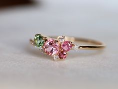 Tourmaline ring, Cluster engagement ring, Pink tourmaline ring, Green tourmaline ring, Tourmaline engagement ring, October birthstone, anniversary gift This beautiful tourmaline cluster engagement ring. Available in 9k/14k/18k yellow, rose or white gold. Same design can be made also with other custom gemstones per request. The sequence of the stones will differ in every ring! Product details: - Solid gold - Diamond - 1.5mm, sapphires - 2, 2.5, 3 and 4mm - Band size is 1.2 mm Ring size - US 3 to Pink And Green Tourmaline Ring, Pink Tourmaline And Diamond Ring, Pink And Green Rings, Pink Cluster Ring, Pink And Green Ring, Pink Tourmaline Birthstone Ring, Antique Emerald Engagement Ring, Pink Tourmaline Engagement Ring, Engagement Ring Pink