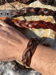 Measures 1 1/4" Wide, will fit any wrist up to 9" Around. Adjustable Western Leather Bracelet For Festivals, Western Style Brown Cuff Bracelet As Gift, Adjustable Hand Tooled Brown Leather Bracelet, Adjustable Hand-tooled Brown Leather Bracelet, Adjustable Black Hand Tooled Bracelet, Western Style Brown Cuff Bracelet For Festivals, Hand Tooled Leather Bracelets For Festivals, Hand Tooled Adjustable Leather Bracelets, Hand Tooled Brown Leather Bracelets