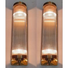 two wall lights with glass panels on each side